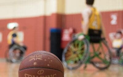 A basketball on the floor during a wheelchair basketball game.